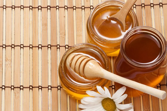 bigstock-pots-of-honey-and-flower-on-wo-268663131.jpg